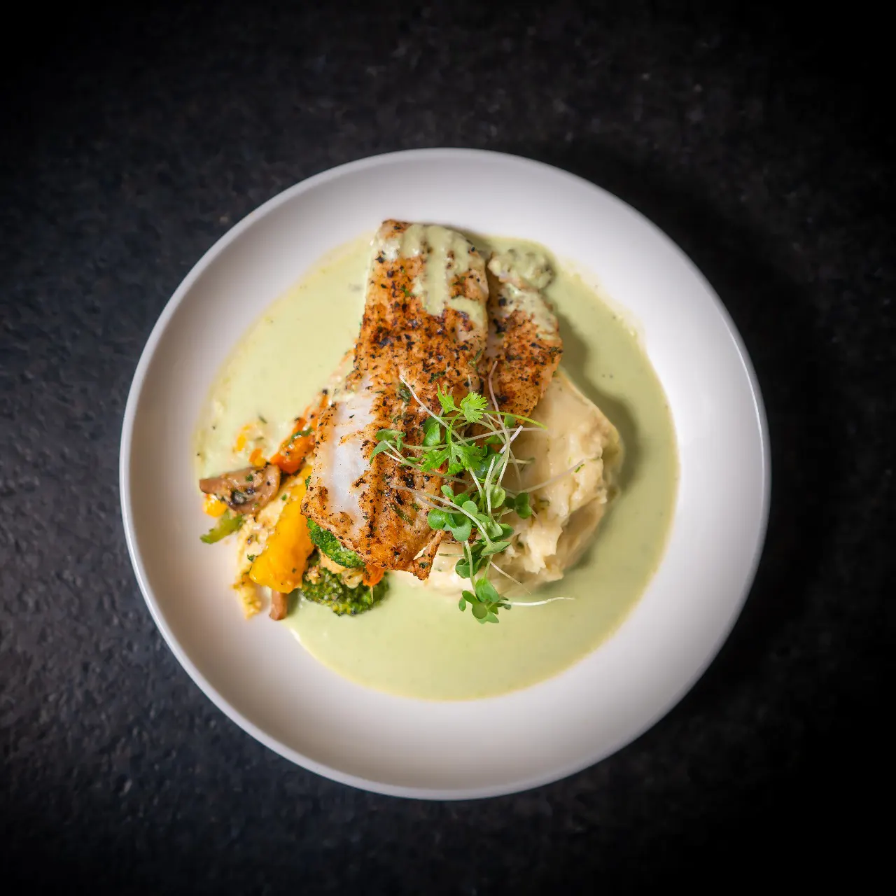 Pan seared fish fillet with green pea puree